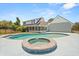 A swimming pool with an attached spa in a spacious backyard, complemented by a well-maintained home exterior at 6803 Round Lake Rd, Mount Dora, FL 32757