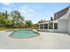 Backyard pool and screened-in patio area next to a home at 6803 Round Lake Rd, Mount Dora, FL 32757