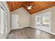 Bright sun room featuring wood ceiling and french doors at 6803 Round Lake Rd, Mount Dora, FL 32757