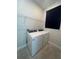 Laundry room featuring a side-by-side washer and dryer, and wire shelving at 734 Via Como St, Poinciana, FL 34759