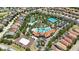Aerial view of community pools, tennis courts, sand volleyball, and common areas in a residential neighborhood at 7554 Oak Spring Ln, Davenport, FL 33837
