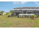 Spacious backyard featuring a screened-in pool area at 7554 Oak Spring Ln, Davenport, FL 33837