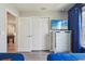 Bright bedroom featuring a mirrored dresser and a wall-mounted TV for a modern feel at 7554 Oak Spring Ln, Davenport, FL 33837