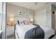 Bedroom features a ceiling fan, stylish decor, and convenient closet space at 7554 Oak Spring Ln, Davenport, FL 33837