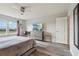 Bedroom featuring a ceiling fan, desk, and large dresser at 7554 Oak Spring Ln, Davenport, FL 33837