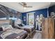 Fun themed ' bedroom with two twin beds, mural, and Star Wars accents at 7554 Oak Spring Ln, Davenport, FL 33837