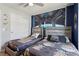Themed ' bedroom with two beds, a mural, and a closet for storage at 7554 Oak Spring Ln, Davenport, FL 33837