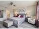 Bedroom with coordinating furniture and adjacent bathroom at 7554 Oak Spring Ln, Davenport, FL 33837