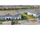 Townhouse with modern architectural style, solar panels, and parking spaces at 7554 Oak Spring Ln, Davenport, FL 33837