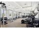 Well-equipped fitness center with modern cardio and weight training machines and ample natural light at 7554 Oak Spring Ln, Davenport, FL 33837