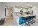 Modern kitchen featuring granite countertops, white cabinets, and stainless steel appliances at 7554 Oak Spring Ln, Davenport, FL 33837