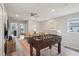 Bright upstairs living room with a foosball table and comfortable seating at 7554 Oak Spring Ln, Davenport, FL 33837