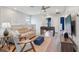 Upstairs living area with neutral decor, comfortable seating, and a foosball table at 7554 Oak Spring Ln, Davenport, FL 33837