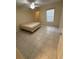 Bedroom showcases tile flooring, ceiling fan, walk-in closet, and window with natural light at 814 Crest Pines Dr # 915, Orlando, FL 32828