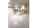 Open floorplan kitchen featuring tile flooring, a breakfast bar, and ample lighting at 814 Crest Pines Dr # 915, Orlando, FL 32828