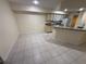 Open concept kitchen with a breakfast bar and tile flooring at 814 Crest Pines Dr # 915, Orlando, FL 32828