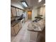 A bright kitchen with stainless steel appliances, ample counter space, and light wood cabinetry at 814 Crest Pines Dr # 915, Orlando, FL 32828