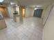 Open floor plan with tile flooring, connecting the living room and kitchen areas at 814 Crest Pines Dr # 915, Orlando, FL 32828