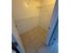 Walk-in closet offers tile flooring and wire shelving for efficient storage at 814 Crest Pines Dr # 915, Orlando, FL 32828