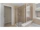 Bathroom featuring a glass-enclosed shower and a soaking tub near a window with blinds at 8554 Tallfield Ave, Orlando, FL 32832
