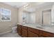Bathroom featuring a double sink vanity with a window view to the side at 8554 Tallfield Ave, Orlando, FL 32832
