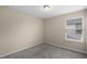 Cozy bedroom featuring neutral walls, carpeting, with a window providing natural light at 8554 Tallfield Ave, Orlando, FL 32832