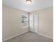Comfortable bedroom with a double door closet and a window with blinds for natural light at 8554 Tallfield Ave, Orlando, FL 32832