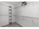 Organized walk-in closet with white wire shelving and a closet organizer tower at 8554 Tallfield Ave, Orlando, FL 32832