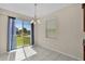 Bright dining area with sliding glass doors and views of the backyard at 8554 Tallfield Ave, Orlando, FL 32832