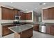 Modern kitchen with granite countertops, stainless steel appliances, and ample cabinet space at 8554 Tallfield Ave, Orlando, FL 32832