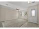 Spacious living room with neutral walls, ceiling fan, and tile entryway at 8554 Tallfield Ave, Orlando, FL 32832