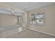 Inviting living room featuring neutral walls, carpet, and bright windows at 8554 Tallfield Ave, Orlando, FL 32832