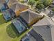 Aerial shot of a house with a screened-in pool and well-maintained backyard at 957 Orange Cosmos Blvd, Davenport, FL 33837