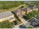 Aerial view of the home with landscaping, lawn, and neighborhood at 957 Orange Cosmos Blvd, Davenport, FL 33837