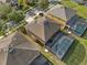 Aerial shot of a house with a screened-in pool and fenced in backyard at 957 Orange Cosmos Blvd, Davenport, FL 33837