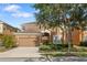 Beautiful two-story home with manicured lawn, landscaping and a two car garage at 957 Orange Cosmos Blvd, Davenport, FL 33837