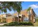 Two-story home with mature landscaping and attached two car garage at 957 Orange Cosmos Blvd, Davenport, FL 33837