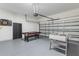 Spacious garage featuring a pool table, foosball table, and dart board for entertainment at 957 Orange Cosmos Blvd, Davenport, FL 33837