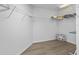 Spacious walk-in closet with custom shelving for optimal organization and storage space at 957 Orange Cosmos Blvd, Davenport, FL 33837