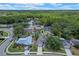 Stunning aerial view of the home with lush greenery, and a serene pond creating a private oasis at 1003 Hart Branch Dr, Oviedo, FL 32765