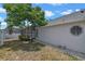 Home exterior with backyard, pool area, landscaping and view of octagonal window at 1003 Hart Branch Dr, Oviedo, FL 32765