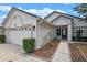Attractive one-level home with two-car garage and landscaped garden leading up to the welcoming doorway at 1003 Hart Branch Dr, Oviedo, FL 32765