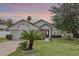 Lovely one-story house showcasing manicured lawn, a two-car garage, and a cozy front entrance path at 1003 Hart Branch Dr, Oviedo, FL 32765