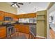 Kitchen area with modern stainless steel appliances and view to the side yard at 1003 Hart Branch Dr, Oviedo, FL 32765