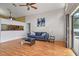Cozy living room with sleek wood flooring and contemporary decor that looks out onto the pool at 1003 Hart Branch Dr, Oviedo, FL 32765