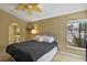 Comfortable bedroom with windows and ceiling fan providing a bright and airy feel at 1003 Hart Branch Dr, Oviedo, FL 32765