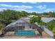 Screened-in pool with ample seating area offers a private outdoor oasis at 1003 Hart Branch Dr, Oviedo, FL 32765