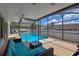 Screened-in pool with a seating area, offering a luxurious outdoor experience and relaxation at 1003 Hart Branch Dr, Oviedo, FL 32765