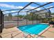 Spacious screened-in pool area ideal for outdoor entertaining and leisure activities at 1003 Hart Branch Dr, Oviedo, FL 32765