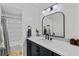 Modern bathroom with sleek vanity, stylish fixtures, and a beautifully tiled shower at 105 Dublin Dr, Lake Mary, FL 32746
